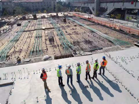 people in construction outfits standing