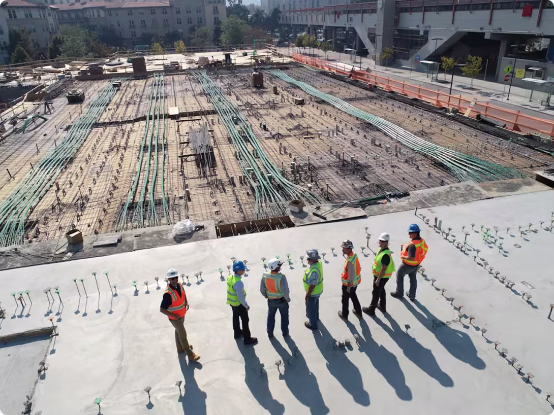 people in construction outfits standing